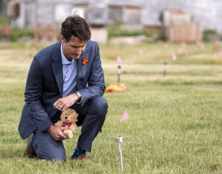 Justin Trudeau and teddy bear stage a photo op at Cowessess Sask